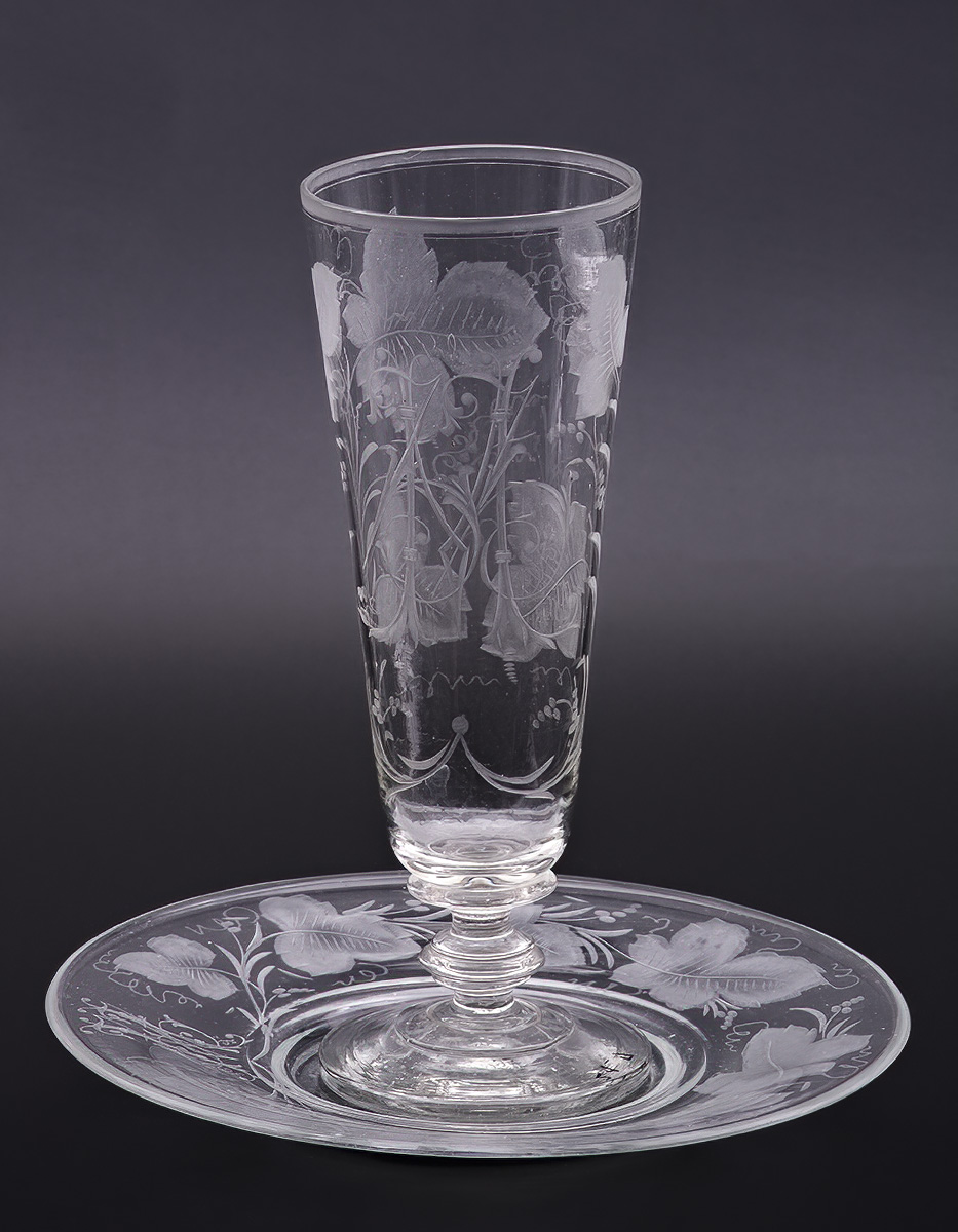 Glass with a saucer